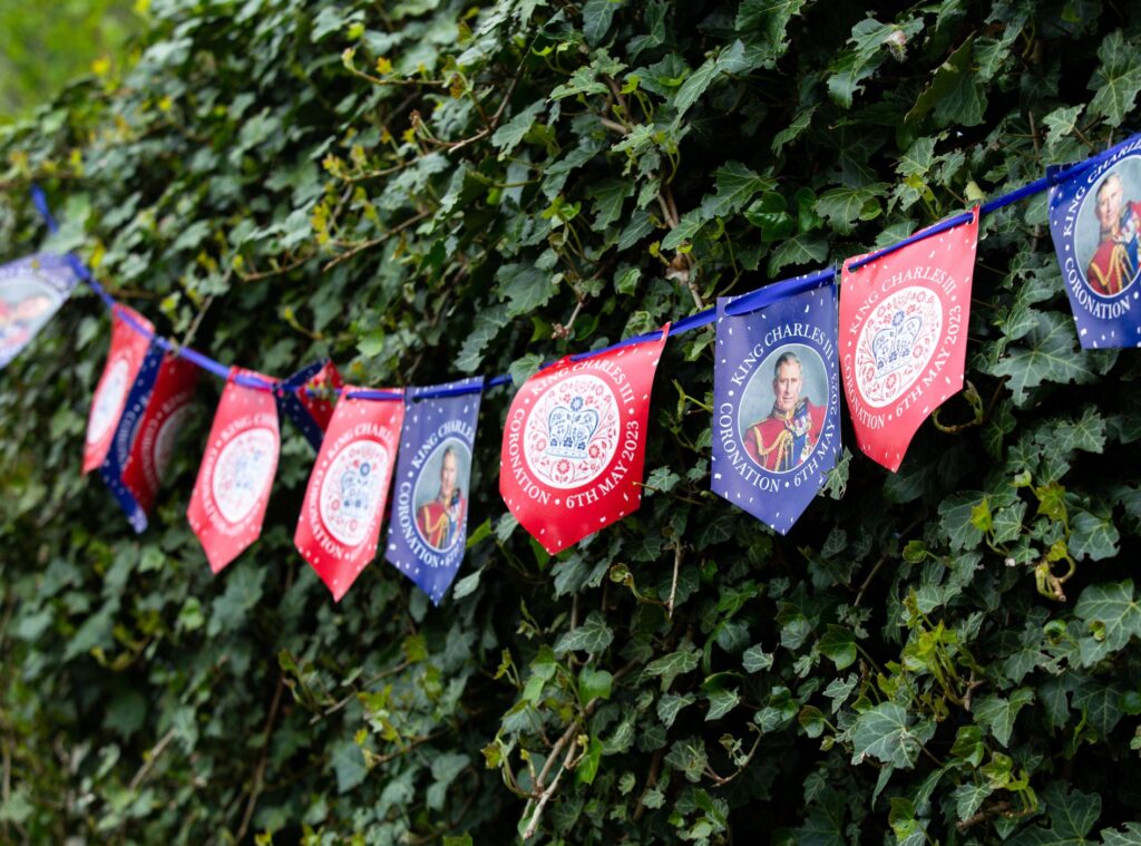 red and blue bunting with a picture of King Charles III
