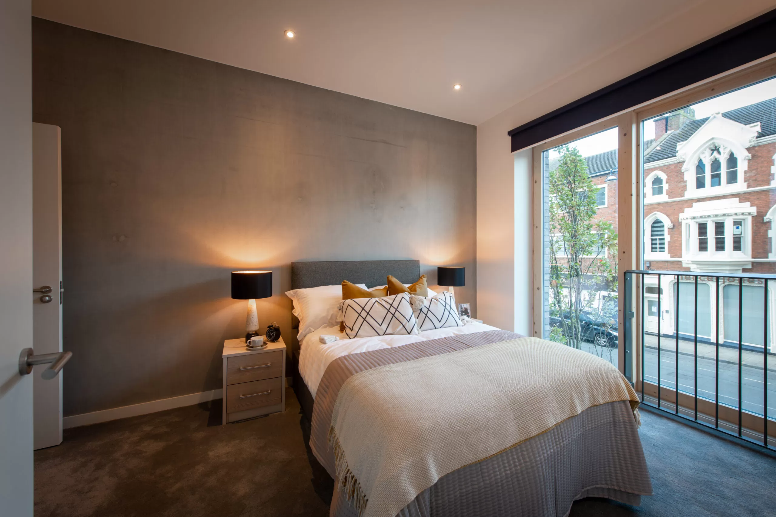 Bedroom with soft grey walls and pastel furnishing