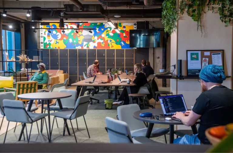 Communal working space with people on laptops