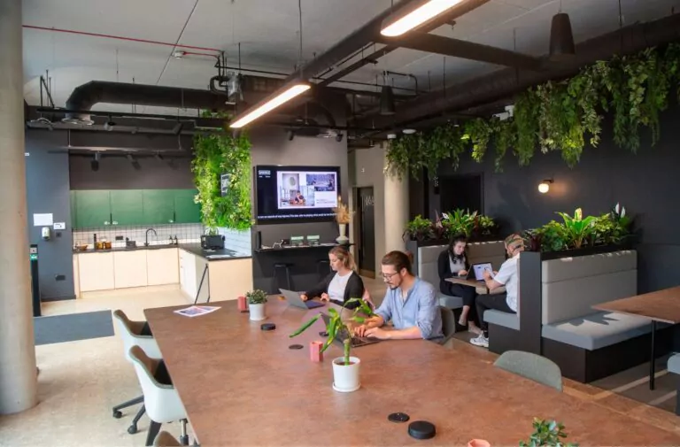 Communal work space with people on laptops