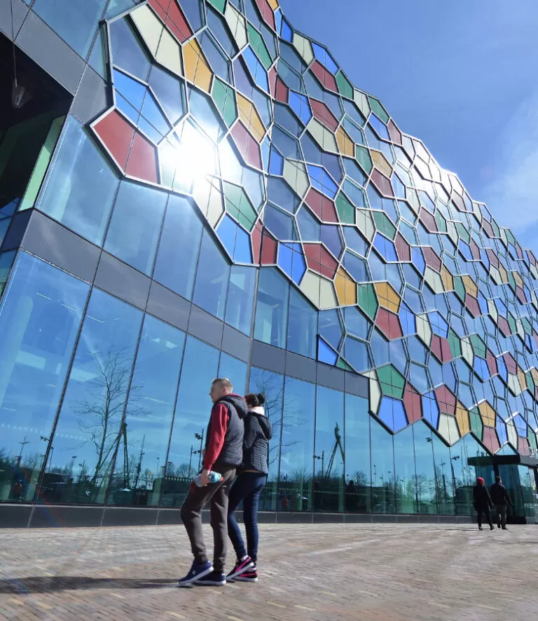 People in front of modern building