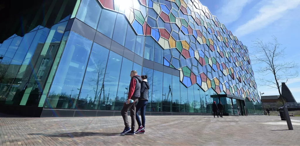 People in front of modern building