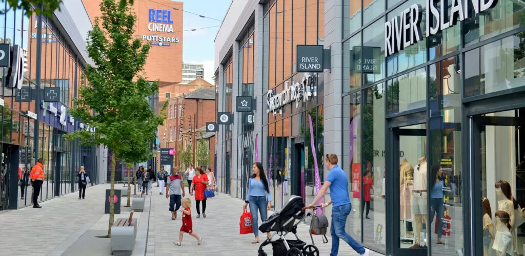 People walking in pedestrianised shopping area